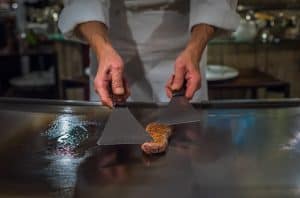 Chef Cooking Wagyu Beef In Japanese Teppanyaki Restaurant, Tokyo