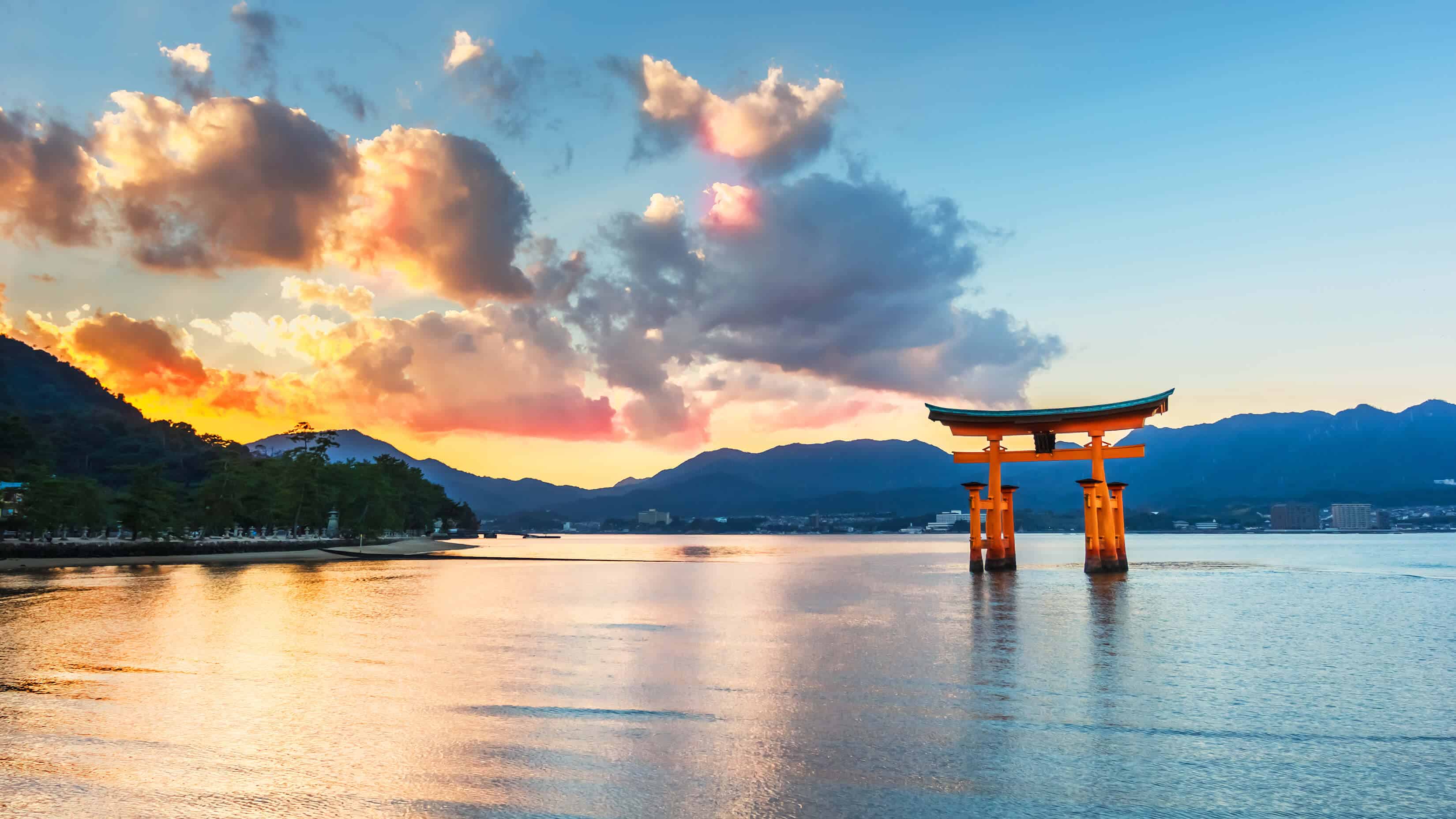Miyajima Floating Torii Gate with a sunrise/sunset in the background.