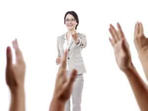 Teacher with Students Hands Raised.jpg