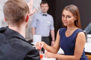 Calling Waiter in Restaurant