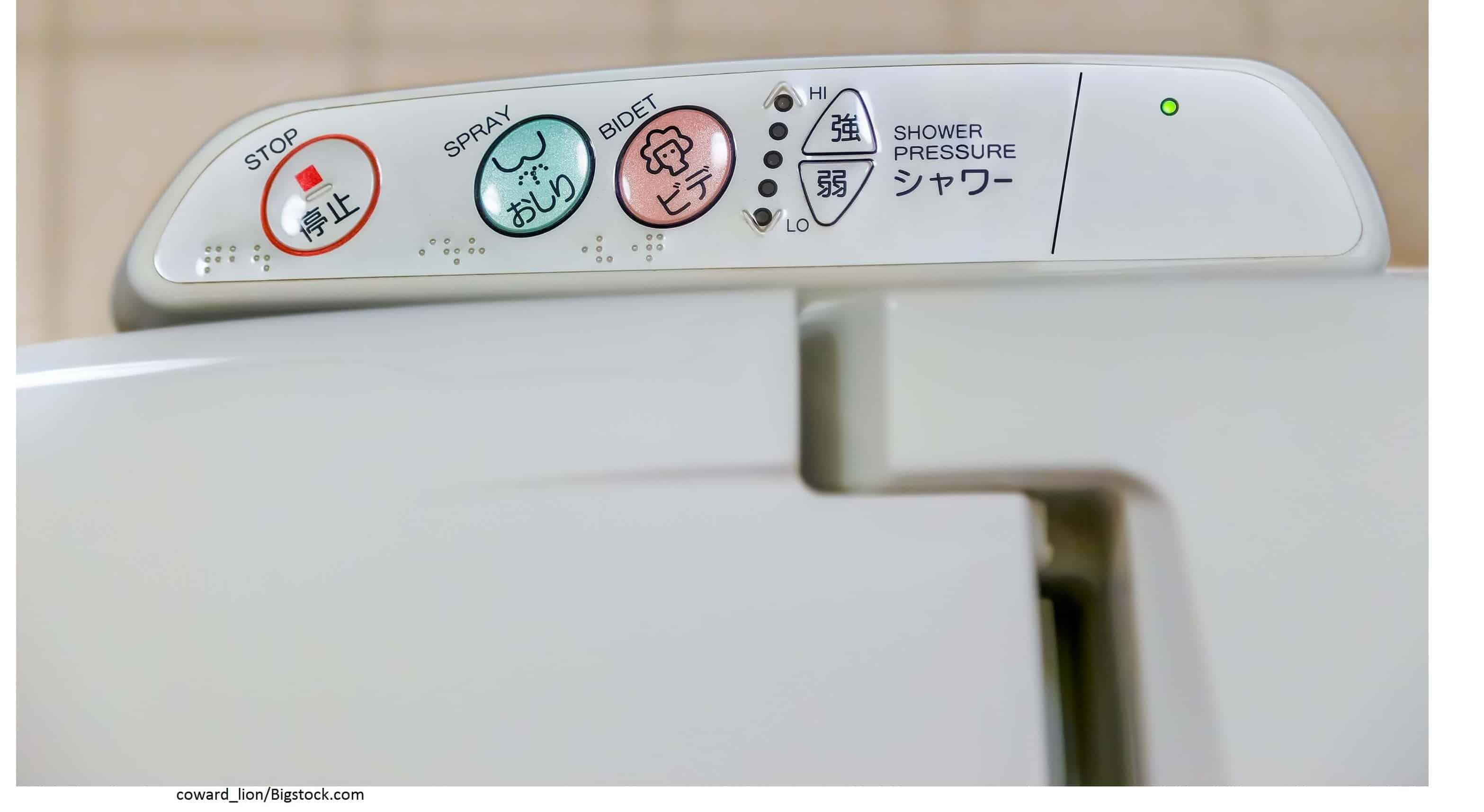 A Japanese Bidet Toilet Armrest with buttons to do several functions.