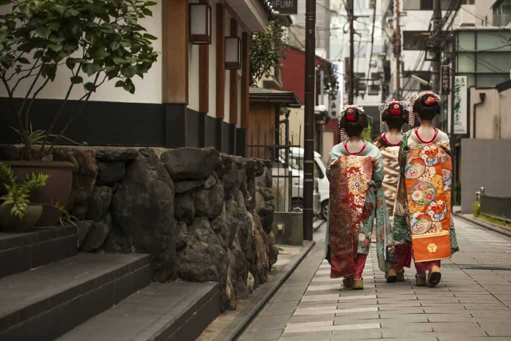 Three Geisha Walking Down the Street in Gion, Kyoto.