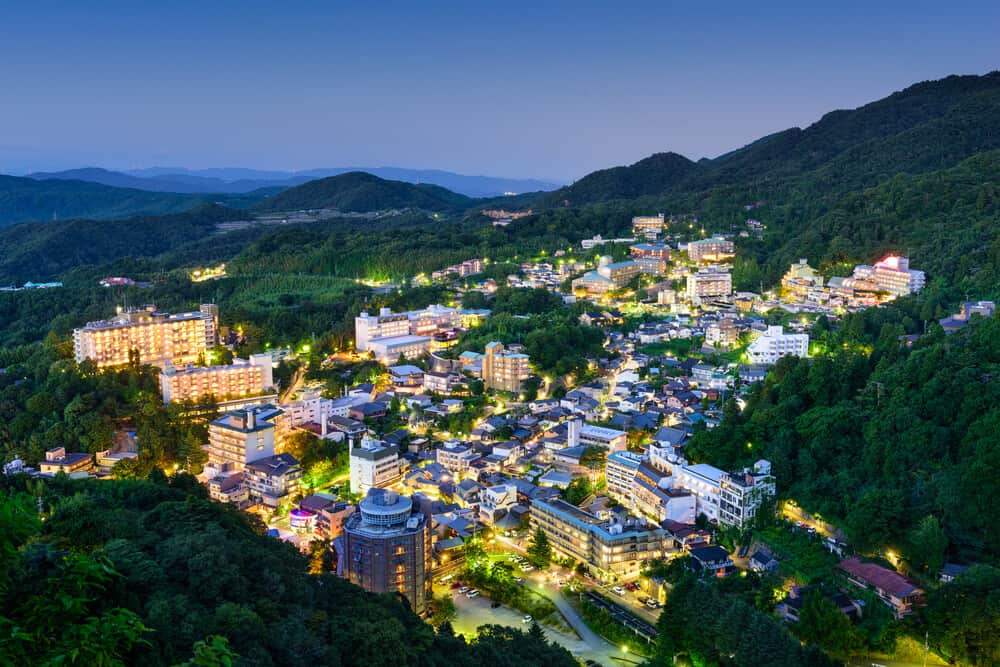 Arima Onsen at Night. This image is taken from high up, capturing the whole town and it's many buildings (onsen).