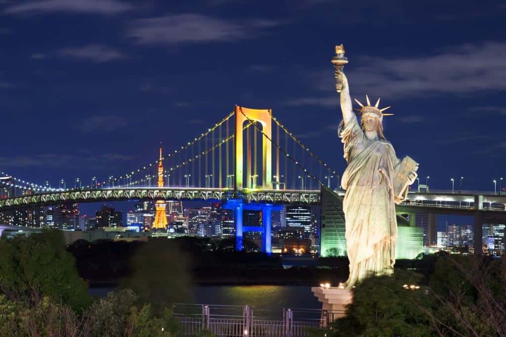 Odaiba with the replica of the Statue of Liberty and the Rainbow Bridge in the background.