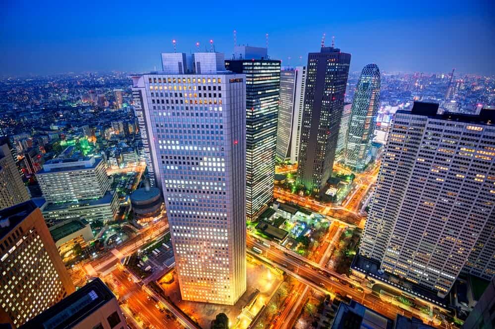 Many buildings as seen from above at night in Shinjuku, Japan.
