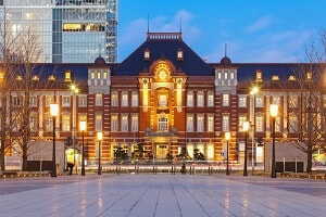 The outside of one of the buildings at Tokyo Station in the evening.