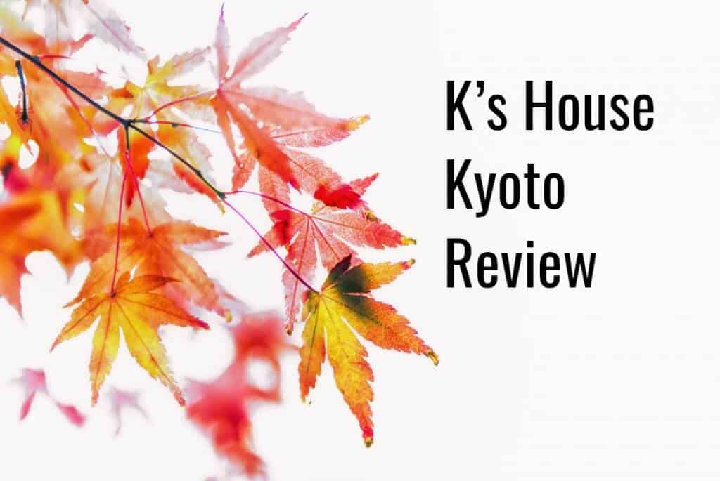 A close up of red and yellow maple leaves on a branch. The text on this images read, "K's House Kyoto Review"