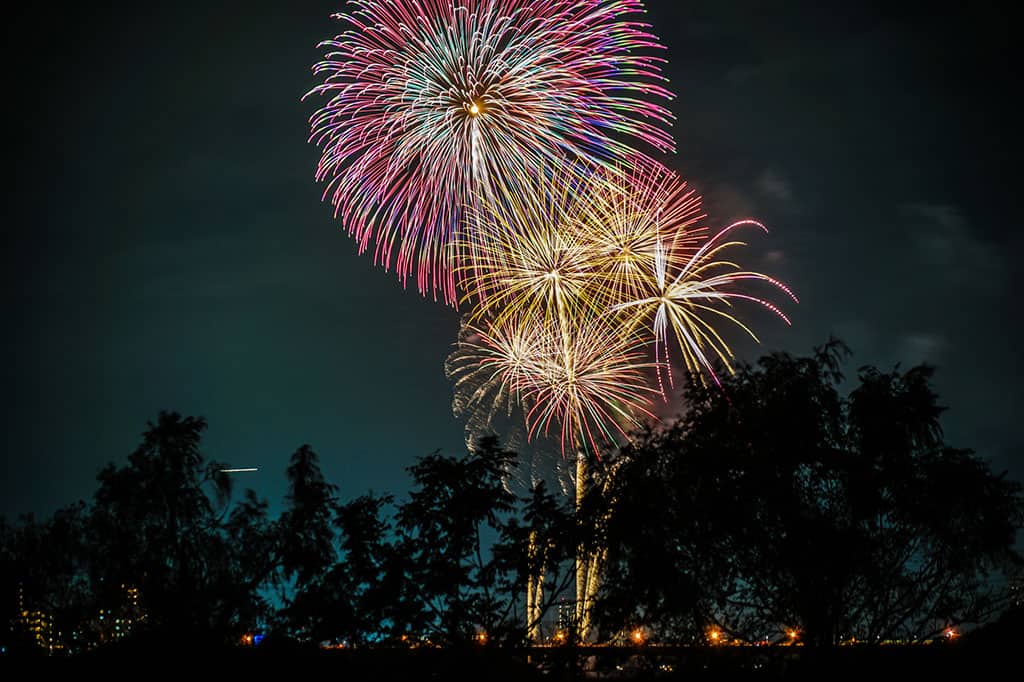 Fireworks display in the air at a event in Japan.